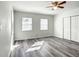 Spacious bedroom with light wood floors, white walls, closet, and natural light at 979 11Th S Ave, St Petersburg, FL 33705