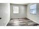 Bright bedroom with wood-look floors and large windows at 979 11Th S Ave, St Petersburg, FL 33705