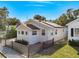 Charming single-story home with a well-kept lawn, tasteful landscaping, and a cozy front porch at 979 11Th S Ave, St Petersburg, FL 33705