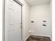 Small laundry room with modern flooring and a new utility door at 979 11Th S Ave, St Petersburg, FL 33705