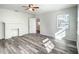 Bright living room featuring light wood floors, white walls, fireplace, and natural light at 979 11Th S Ave, St Petersburg, FL 33705