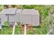 Aerial view of condo building, showing rooflines, landscaping, and walkways at 10 Aster Pl, Oldsmar, FL 34677