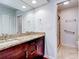 Double vanity bathroom with granite countertop and walk-in shower at 10 Aster Pl, Oldsmar, FL 34677