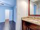 Bathroom with granite countertop and modern vanity at 10 Aster Pl, Oldsmar, FL 34677