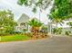 Ardea Country Club clubhouse, featuring landscaping and palm trees at 10 Aster Pl, Oldsmar, FL 34677