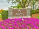 Ardea Country Club entrance sign with vibrant flowers at 10 Aster Pl, Oldsmar, FL 34677