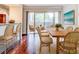 Dining room with wooden table, wicker chairs, and access to a patio at 10 Aster Pl, Oldsmar, FL 34677