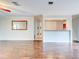 Bright living room with hardwood floors and kitchen pass-through at 10 Aster Pl, Oldsmar, FL 34677