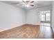 Bright living room featuring hardwood floors and sliding doors to patio at 10 Aster Pl, Oldsmar, FL 34677
