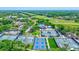 Aerial view of tennis and pickleball courts, near clubhouse and pool at 10 Aster Pl, Oldsmar, FL 34677
