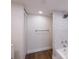 Bright bathroom with marble shower and wood-look floors at 100 Oakmont Ln # 309, Belleair, FL 33756