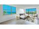 Living room with ocean view and comfortable seating at 100 Oakmont Ln # 309, Belleair, FL 33756