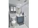 Modern bathroom with blue vanity, marble countertop, and gray accents at 1001 S Bayshore Blvd # 205, Safety Harbor, FL 34695