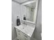 Bright bathroom featuring a white vanity and marble countertop at 1001 S Bayshore Blvd # 205, Safety Harbor, FL 34695