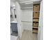 Well-organized closet with shelves and hanging rod at 1001 S Bayshore Blvd # 205, Safety Harbor, FL 34695