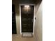 Dark brown front door with a keypad and a small welcome mat at 1001 S Bayshore Blvd # 205, Safety Harbor, FL 34695