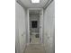 Bright hallway with light wood flooring and closets at 1001 S Bayshore Blvd # 205, Safety Harbor, FL 34695