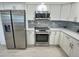 Modern kitchen with stainless steel appliances and white cabinets at 1001 S Bayshore Blvd # 205, Safety Harbor, FL 34695