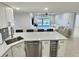 Modern kitchen with stainless steel appliances and wine cooler at 1001 S Bayshore Blvd # 205, Safety Harbor, FL 34695