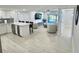 Open concept kitchen and living area, featuring modern appliances and flooring at 1001 S Bayshore Blvd # 205, Safety Harbor, FL 34695
