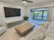 Light and airy living room with water view and sliding glass doors at 1001 S Bayshore Blvd # 205, Safety Harbor, FL 34695