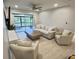 Bright living room with water views and comfy seating at 1001 S Bayshore Blvd # 205, Safety Harbor, FL 34695