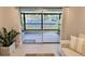 Living room with glass sliders opening to a waterfront view at 1001 S Bayshore Blvd # 205, Safety Harbor, FL 34695