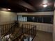 Indoor stairwell with dark brown railings at 1001 S Bayshore Blvd # 205, Safety Harbor, FL 34695