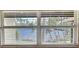 Window view overlooking a tranquil canal and lush greenery at 1001 S Bayshore Blvd # 205, Safety Harbor, FL 34695