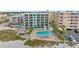 Aerial view showcasing the building and beachfront location at 12924 Gulf Blvd # 307, Madeira Beach, FL 33708