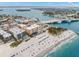 Aerial view of beachfront property with pool and ocean access at 12924 Gulf Blvd # 307, Madeira Beach, FL 33708