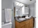 Bathroom features a vanity with granite countertop at 12924 Gulf Blvd # 307, Madeira Beach, FL 33708