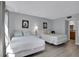Bedroom with two queen beds and window access at 12924 Gulf Blvd # 307, Madeira Beach, FL 33708