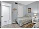 Bedroom with two twin beds and light wood flooring at 12924 Gulf Blvd # 307, Madeira Beach, FL 33708