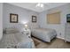 Bright bedroom featuring two twin beds and ample natural light at 12924 Gulf Blvd # 307, Madeira Beach, FL 33708