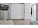 Bedroom with large closet, dresser, and flat-screen TV at 12924 Gulf Blvd # 307, Madeira Beach, FL 33708