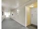 Clean and well-lit hallway leading to the condo unit at 12924 Gulf Blvd # 307, Madeira Beach, FL 33708