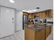 Kitchen with stainless steel appliances and granite countertops at 12924 Gulf Blvd # 307, Madeira Beach, FL 33708