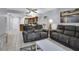 Living room with comfortable seating and access to kitchen at 12924 Gulf Blvd # 307, Madeira Beach, FL 33708