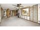 Open living area undergoing renovation, showing studs and flooring at 14081 W Parsley Dr, Madeira Beach, FL 33708