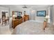 Bedroom with double bed, dresser, and access to bathroom at 1559 Glengarry Dr, Palm Harbor, FL 34684