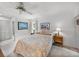 Main bedroom with double bed, ceiling fan, and wood dresser at 1559 Glengarry Dr, Palm Harbor, FL 34684