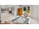 Living room with wood cabinet and view into sunroom at 1559 Glengarry Dr, Palm Harbor, FL 34684