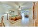 Bright and airy living room with comfortable seating and tile floors at 15614 Aurora Lake Cir, Wimauma, FL 33598