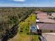Aerial view of a home with a pool and large backyard at 16122 Cedar Key Dr, Wimauma, FL 33598