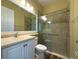 Bathroom with walk-in shower, toilet and vanity at 16122 Cedar Key Dr, Wimauma, FL 33598