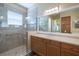 Bathroom featuring a walk-in shower and modern vanity at 16122 Cedar Key Dr, Wimauma, FL 33598