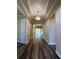 Elegant foyer with high ceilings and hardwood floors at 16122 Cedar Key Dr, Wimauma, FL 33598