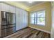 Kitchen with built-in pantry and stainless steel refrigerator at 16122 Cedar Key Dr, Wimauma, FL 33598
