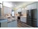 Modern kitchen with stainless steel appliances at 16122 Cedar Key Dr, Wimauma, FL 33598